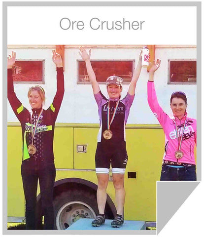 Q Energy Drink Healthy Ambassador Sandra Walter on top of the Podium at Ore Crusher